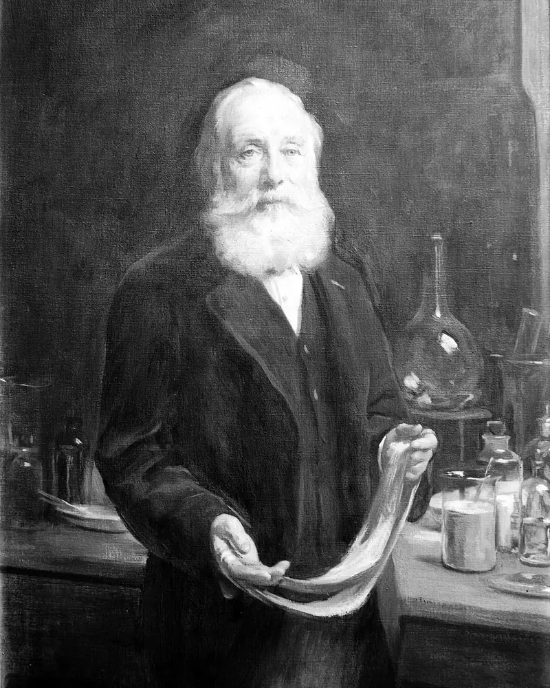 Retrato al óleo de Sir William Henry Perkin, con barba blanca, en su laboratorio, sosteniendo una tela teñida
